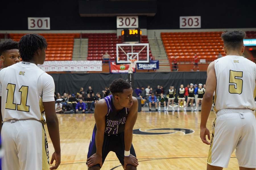 Junior Trey Bates waits for senior Bryce Yoder to throw the ball in after a jump ball for the Pirates.