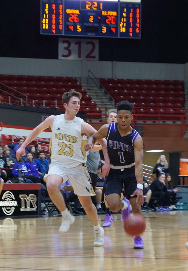 Doc Covington runs down the court for a basket. Right before the end of the first quarter ending it 17-10 Andover.