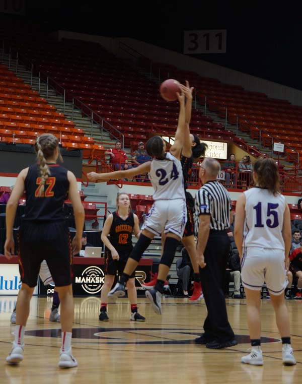 Junior LaKya Leslie tips the ball to a teammate to start the third-place game at March 10.