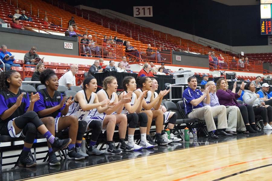 The bench comes alive to congratulate their teammates on another basket as it becomes clear that the Pirates would win the game, pulling ahead 20 points at the end.