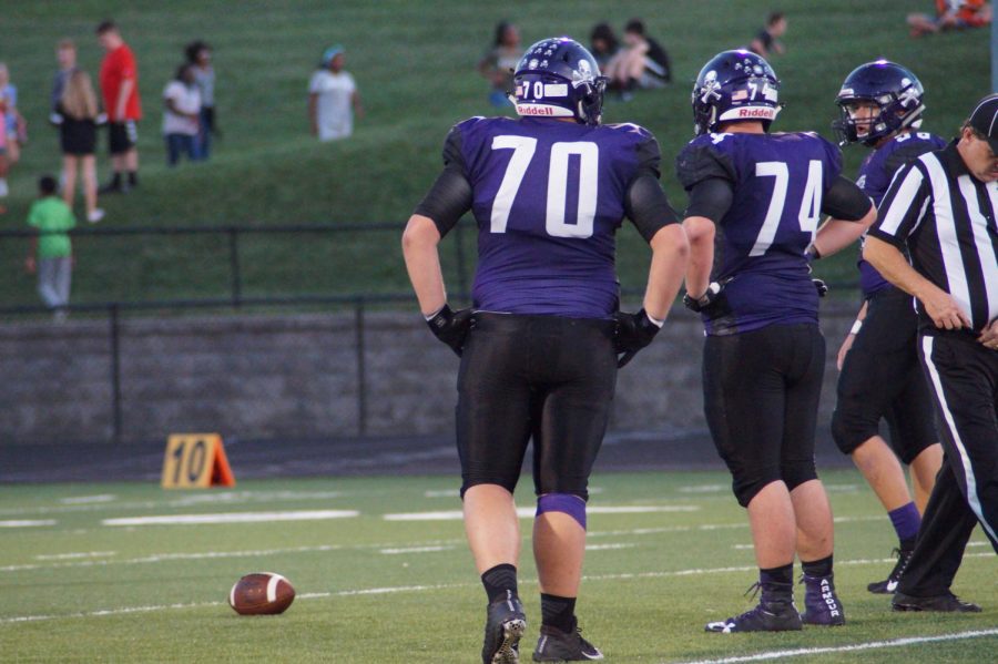 Junior Cooper Beebe, Corbin Fullerton and senior Nicholas Morris discuss a play.