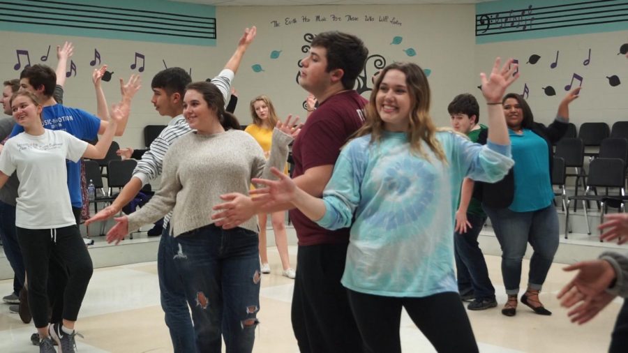 Senior Grace Vogel and junior Drew Novak dance to Footloose while rehearsing for Stage Live.