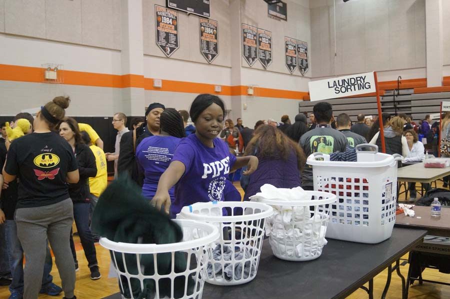 Laqwanza Williams seperates the laundry in the Job Olympics. Although she did not get a medal for this category, she did in her other category.