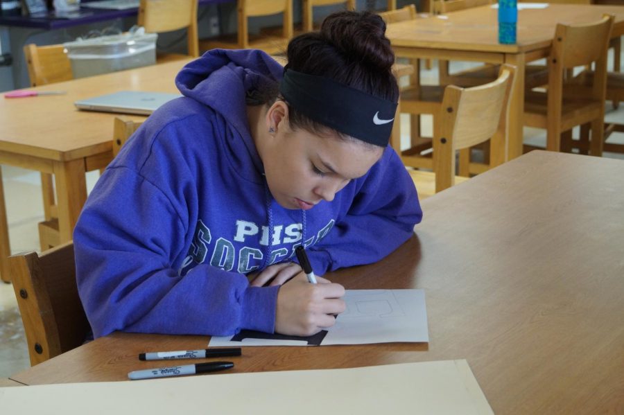 Senior Emma Morgan works in the library.