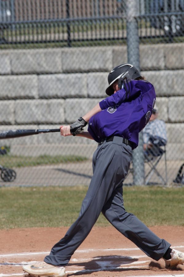 Junior Brendyn Bard swings for a pop up ball against the Bobcats