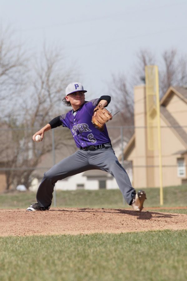Junior Kimball Backus pitches the ball to strike out a batter 