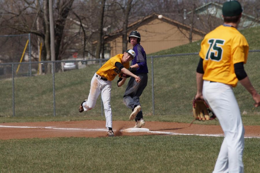 Sophomore Brendyn Bard  looks back at the game after getting an out against Basehor, April 11
