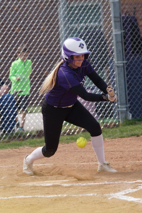 Junior Macey Nigh hits a ground ball against the Ottawa cyclones