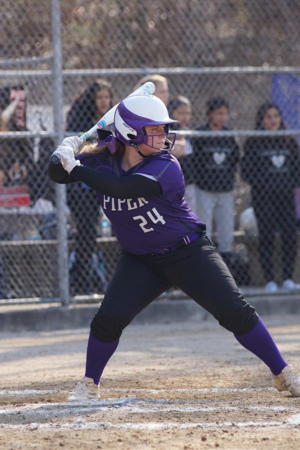 Senior Kamryn Sparks prepares to swing for a ground ball against Bishop Ward