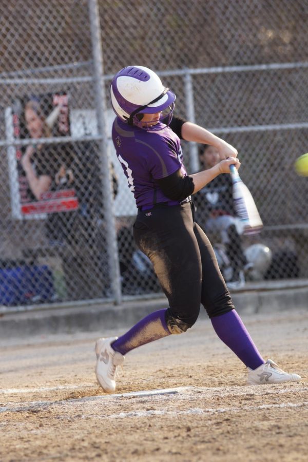 Junior Hannah Pappert hits the ball for a double on April 5 against Bishop Ward