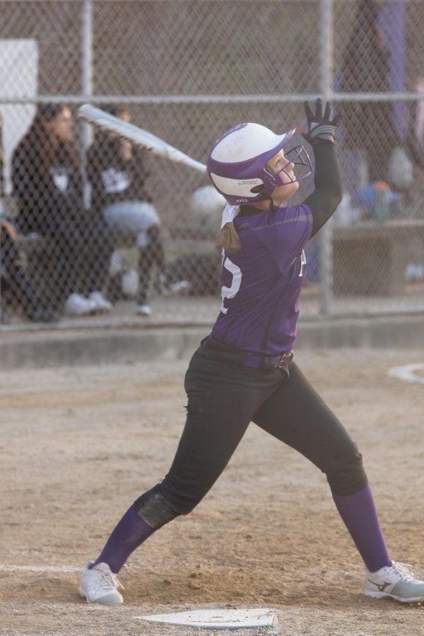 Sophomore Emma Martin watches the ball as she prepares to secure a double for the Lady Pirates