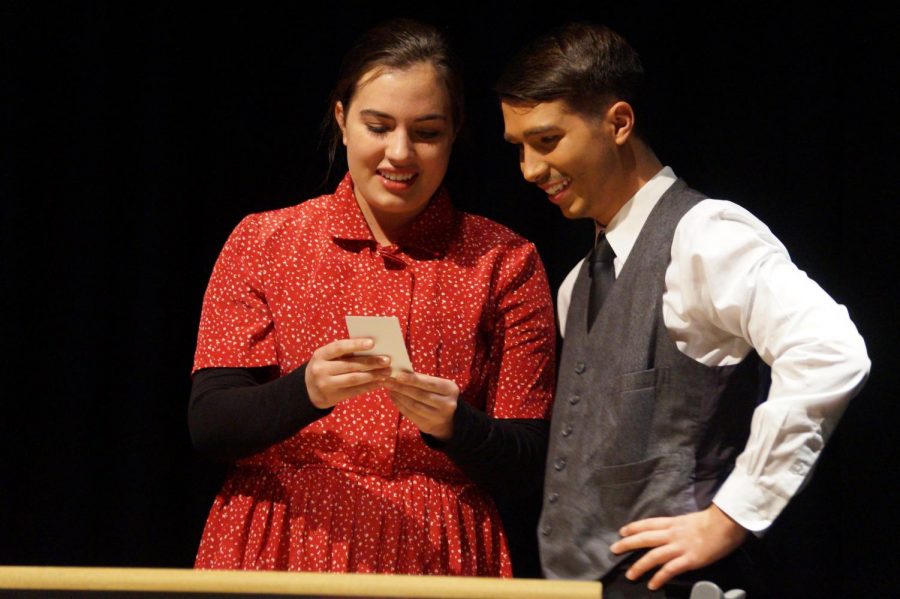 Seniors Kara Evans and Isaia Wilcoxen, also known as Grace Fryer and Tommy pick out wallpaper for their nursery during the schools production of Radium Girls.