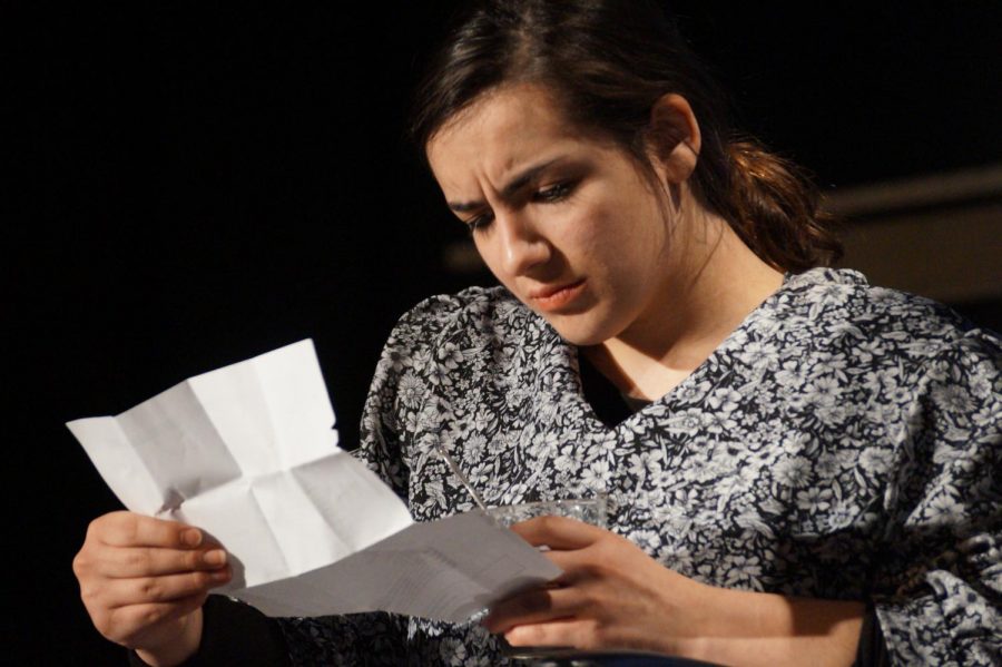 Junior Ally Viera playing Katherine Schuab examines the settlement deal that was presented to the radium girls.