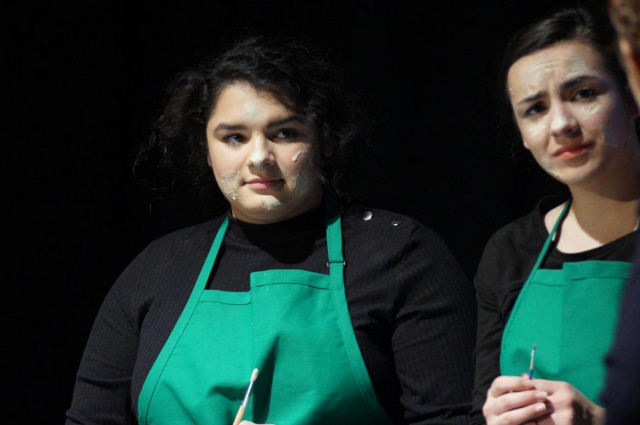 Senior Rachel Bertrand, playing Irene Rudolph and Junior Ally Viera playing Katherine Schuab listen intently as they are reprimanded by one of the managers.