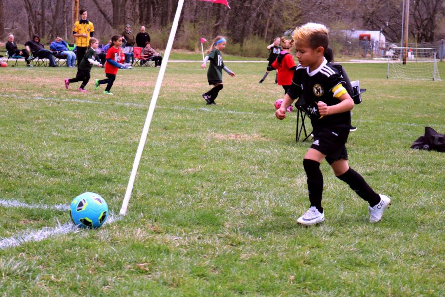 Soccer Player, Gabriel is making a corner kick.