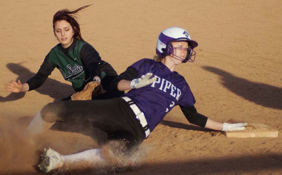 Senior Emma Golden slides into third, but is ruled out by the umpire. Although Golden was called out, the Pirates had all but sealed the win with a five-run lead heading to the seventh inning.
