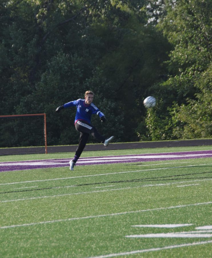 Senior Jamison Foglesong kicks the ball down the field after making a great save. 