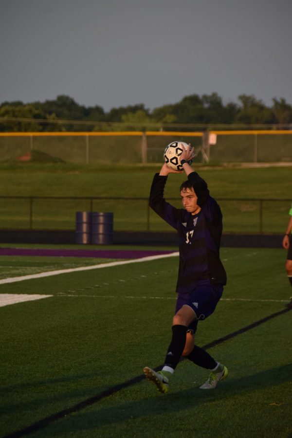 Senior Trey Trumbo throws in a ball to a teammate. 