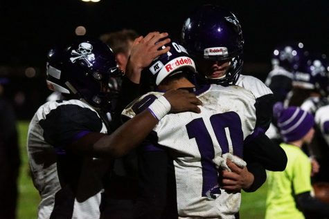 Sophomore Brandan Snell, Freshman Karson Schaunaman, an Senior Dalton White come together in a huddle as the season came to an end, losing their game to the Wildcats 48-0.