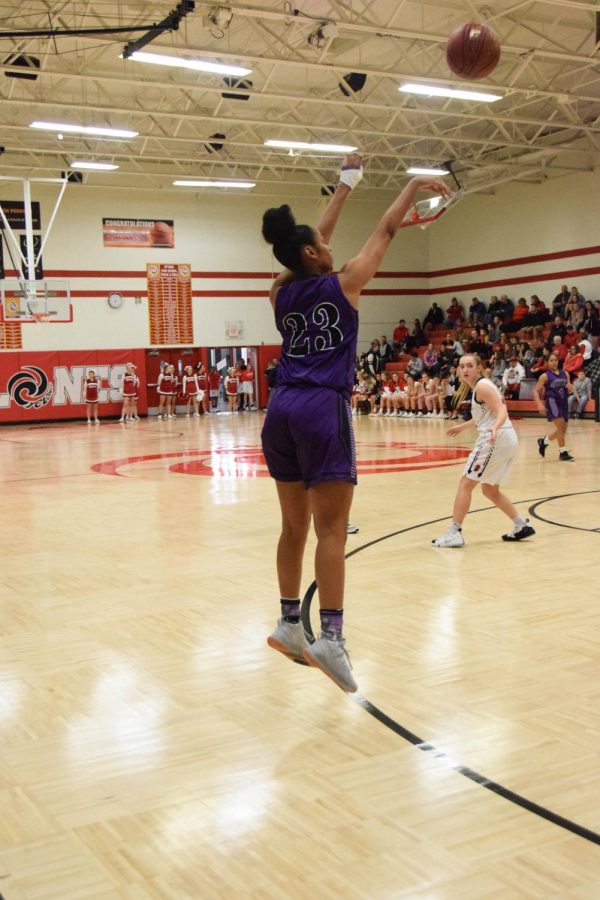 Senior Ryan Cobbins drains a three-pointer. 