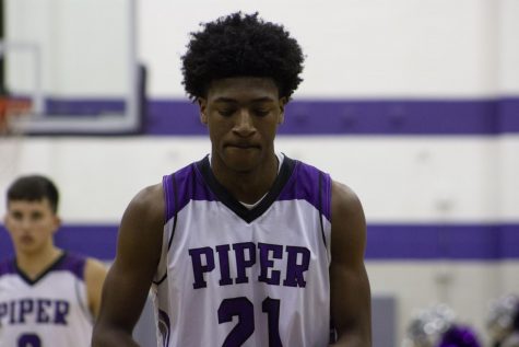 Brandan Jackson shoots the first two points of the game. Piper had previously missed a three pointer and a layup.