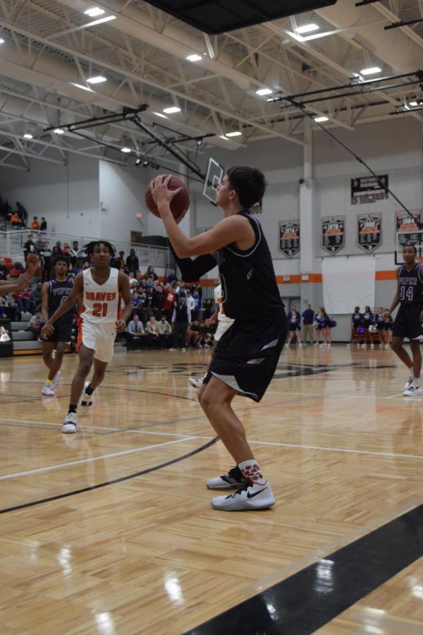 Junior Tyren Shelley shoots a three in the first quarter, putting the Pirates in the lead. However, their lead was short-lived, as the game ended in a loss for Piper 67-60. 