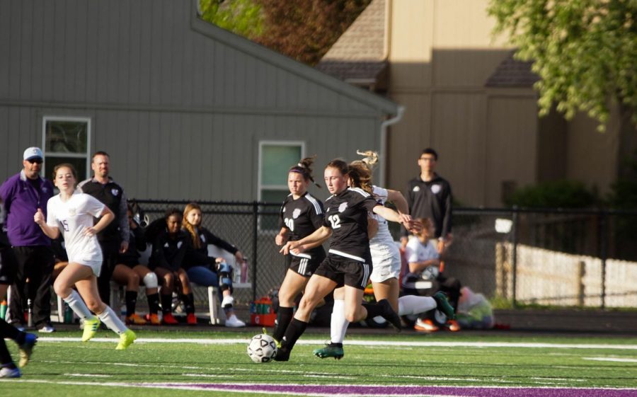 Junior Riley Porter boots the ball down field to the Pirates' offensive players. 