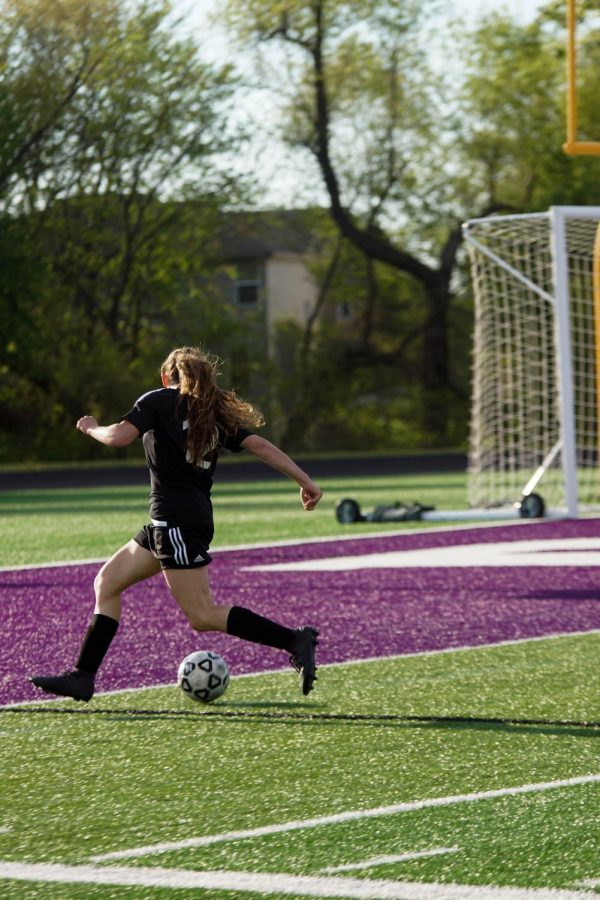 Junior Riley Porter prepares to shoot a goal after advancing down field from her defensive position. 