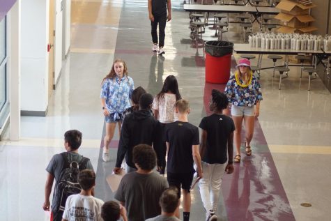 Senior Riley Porter and Sophomore Zoey Pudenz lead freshmen on a tour around a school.  Student Council gave tours of the school to the incoming freshmen on August 12.