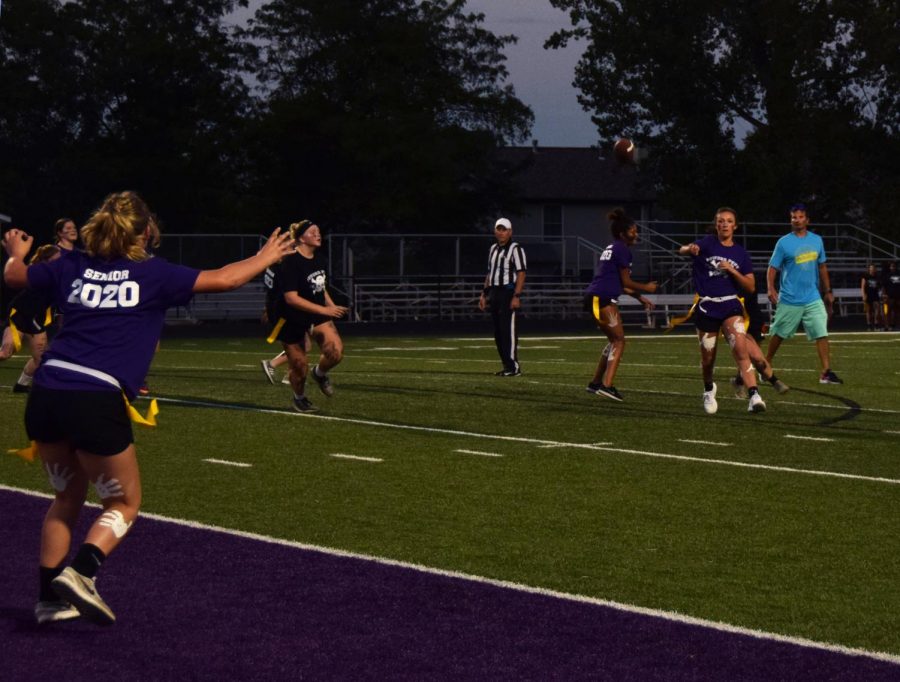 Senior Grace Banes throws to senior Emma Martin who's waiting in the end zone during the second quarter of Powderpuff. 