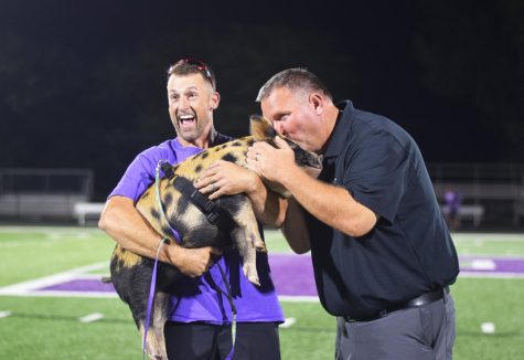 At the end of Powder Puff, football coach Rick Pollard gave Emmett the Pig a smooch. The kiss was inspired by a project Grad fundraiser. 