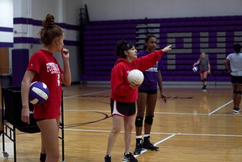 Coach, Rachel Ferguson, introduces a new passing drill at practice Wednesday, Sept. 25. This is Ferguson’s first year coaching at Piper. 