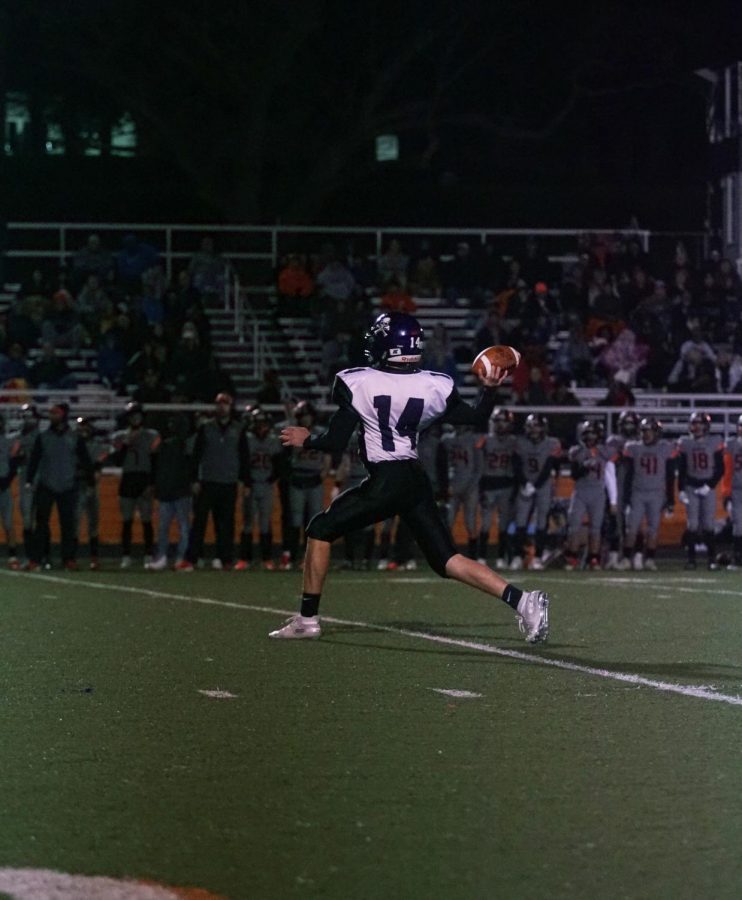 Freshman Logan Ladish throws to an open receiver for a first down in the second quarter. 