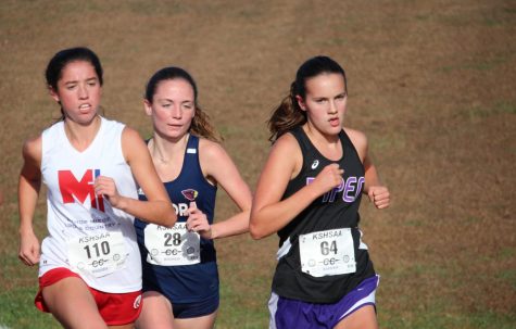 Freshman Grace Hanson moves towards the front of the pack in the regional race. Hanson went on to place second at the state race in Wamego.