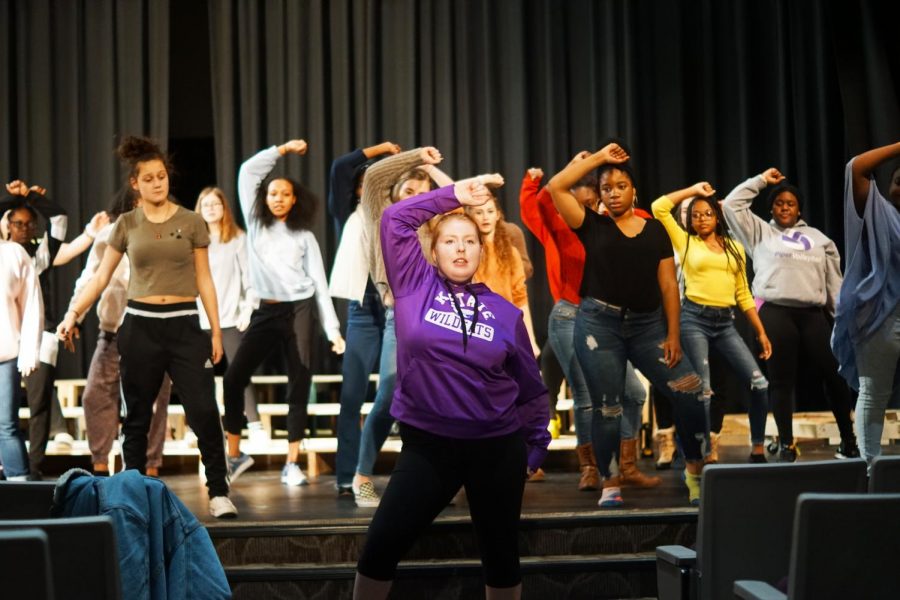 Sophomore Maddie Lamb teaches choreography to cast at musical practice. 