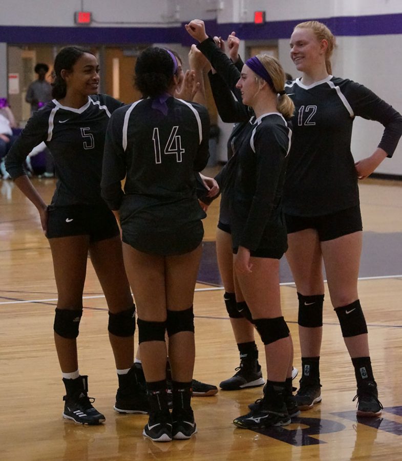 The Volleyball team breaks down a huddle before the start of the game against Louisburg October 22.