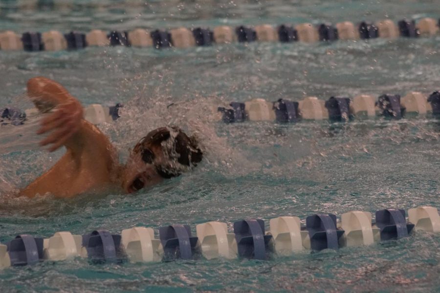 Sophomore Jake Huisman swims at a meet during his freshman year. 