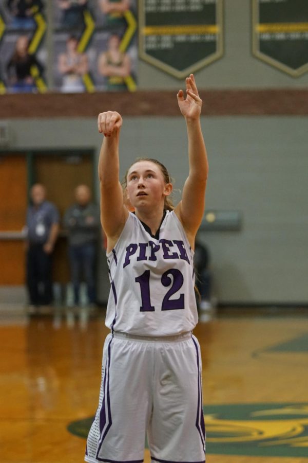 Senior Riley Porter shoots a free throw in the Bobcat Invitational Tournament.