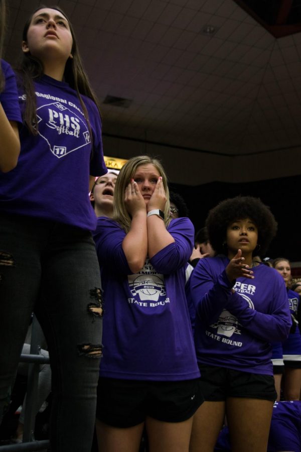 Senior Emma Martin and Kaylin Miller disgree with a referee's call in an intense moment during the Pirates v. Buhler game. "It's an amazing feeling when you cheer on your team on the court, and go through the same emotions they are on the sidelines," Miller said. 