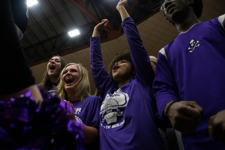 Seniors Emma Martin and Kaylin Miller chant with the Pirates cheerleaders during a time out at the 4a State Basketball Tournament on March 12. Miller will cherish the memories she has made on the sidelines. I will miss being able to see our teams win and how much energy we had when we cheered them on, Miller said. 