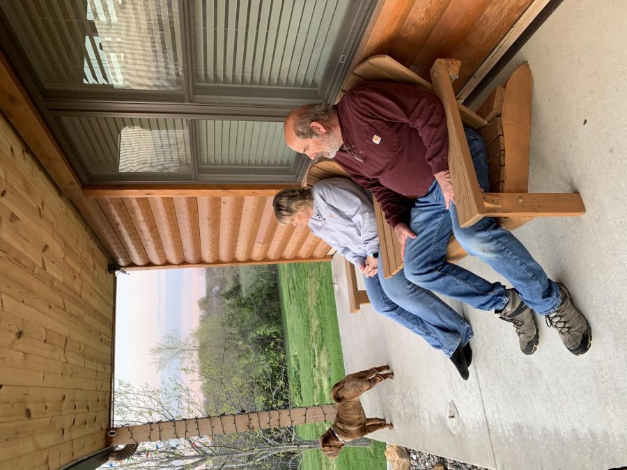 Leigh Ann and Vince Wohletz looking out into the front yard after a day of work at the house on the evening of April 15. They both worked on the yard throughout the day while also doing some other things in the house. 
Photographed by Alex Ivanuska
