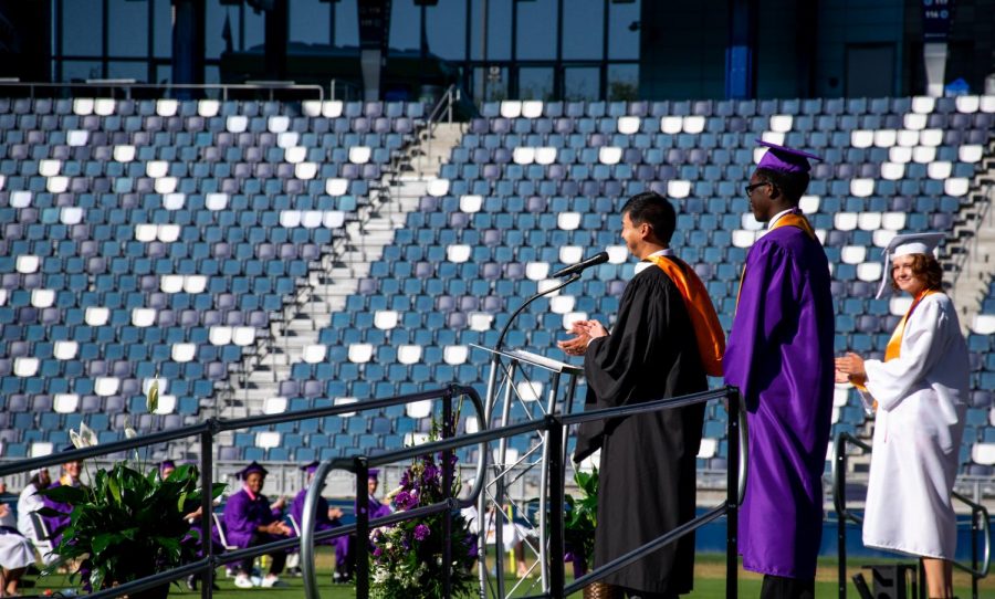 Principal John Nguyen recognizes Obinna Okoye as Valedictorian, and Martha Wolf as Salutatorian.