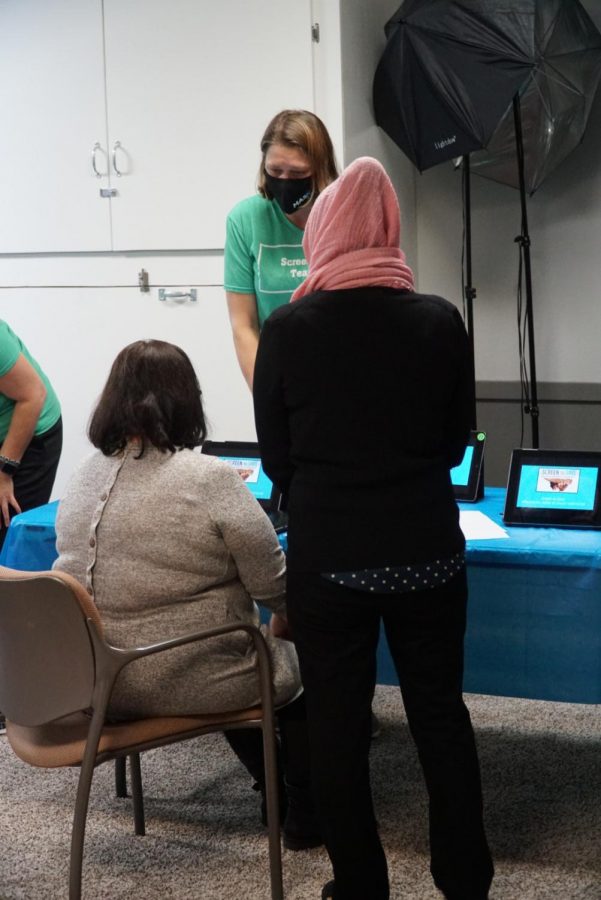 Cancer educator, Michelle Springer, sets up a video on an iPad to demonstrate the dangers of regular smoking.