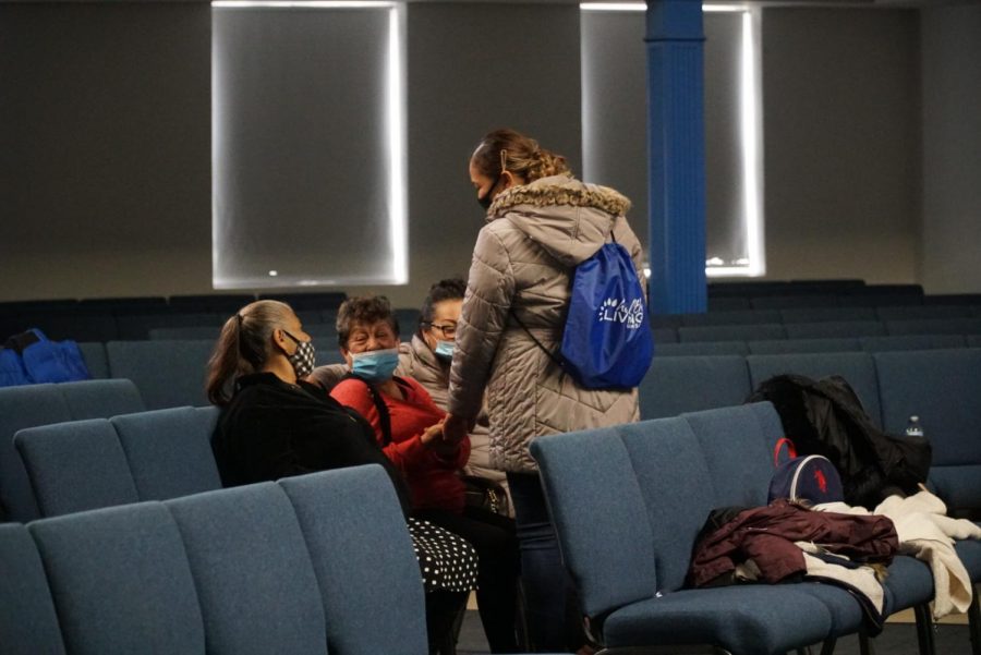 Family members gather in the waiting area before the screening begins.
