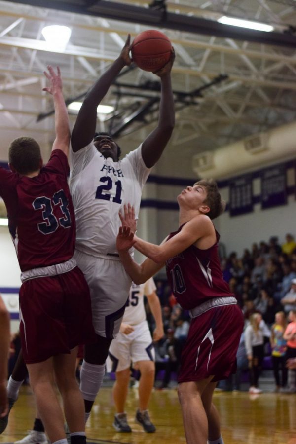 Sophomore Lance Bassett goes up for a layup against Eudora last season.