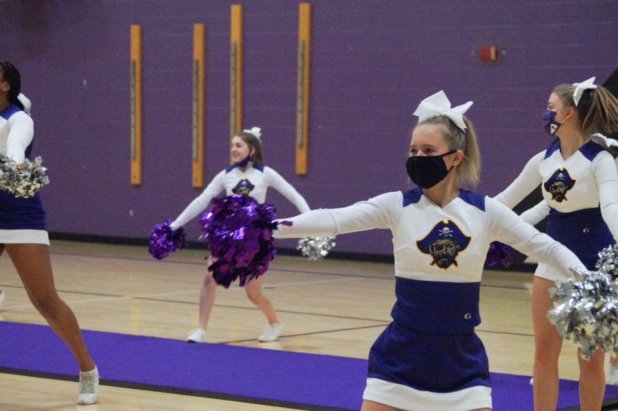 Taylor Miles hits the choreography at Cheer State at the high school. The team took seventh in their first year competing at the 5A level.