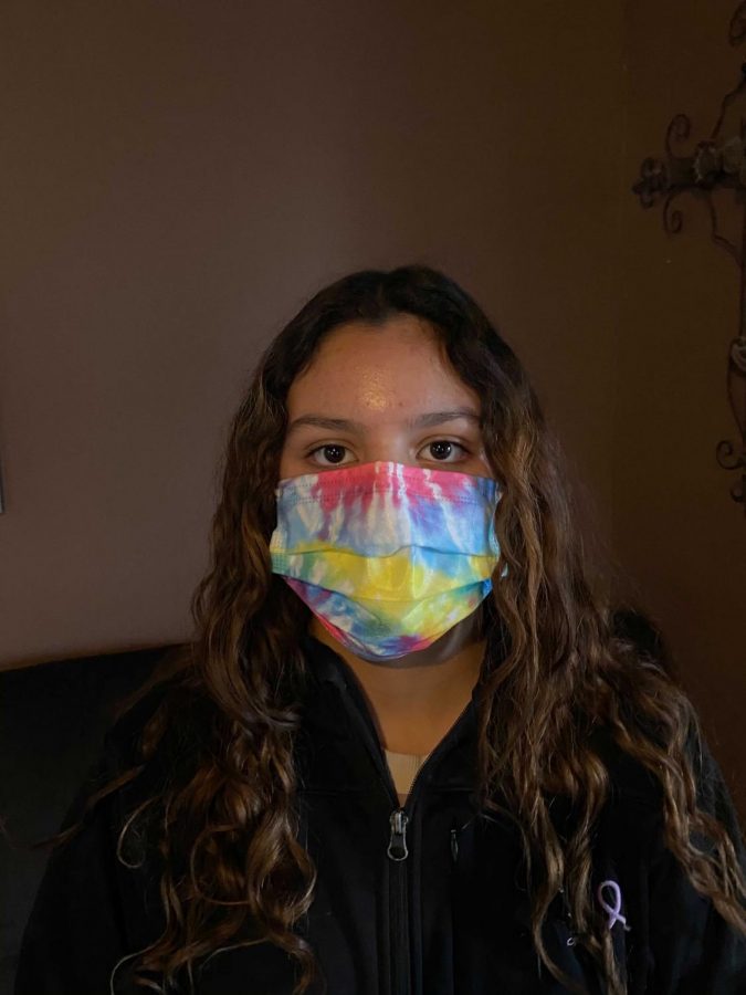 Student April Gildo wears one of her many masks which have become a vital accessory.  