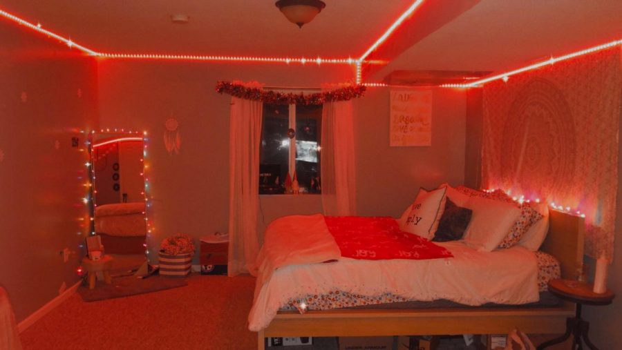 Junior Kaylee Shutte expresses Christmas with red lights covering her room Dec. 12. Along with many others, lights are a popular set up for Christmas and daily room decor.
photo by Victoria LaRocca