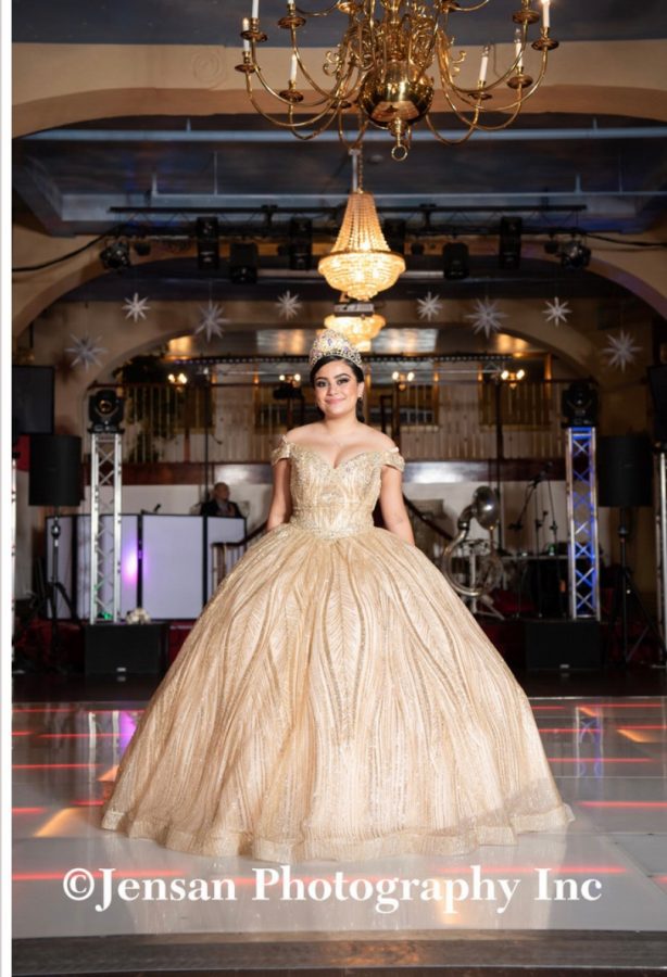 Sophomore Annalia Escalante poses for a photo prior to the start of her Quinceañera. 