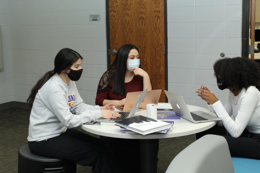 Sophomores Jackie Gildo, Annalia Escalante, and Deanna Jones converse during newspaper stay late night.